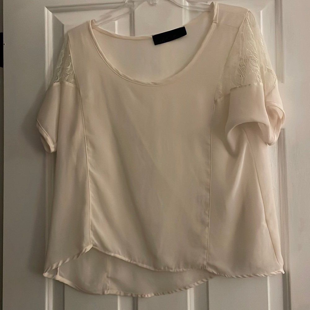 Medium Blue Rain cream short sleeve shirt with lace detail on sleeve.